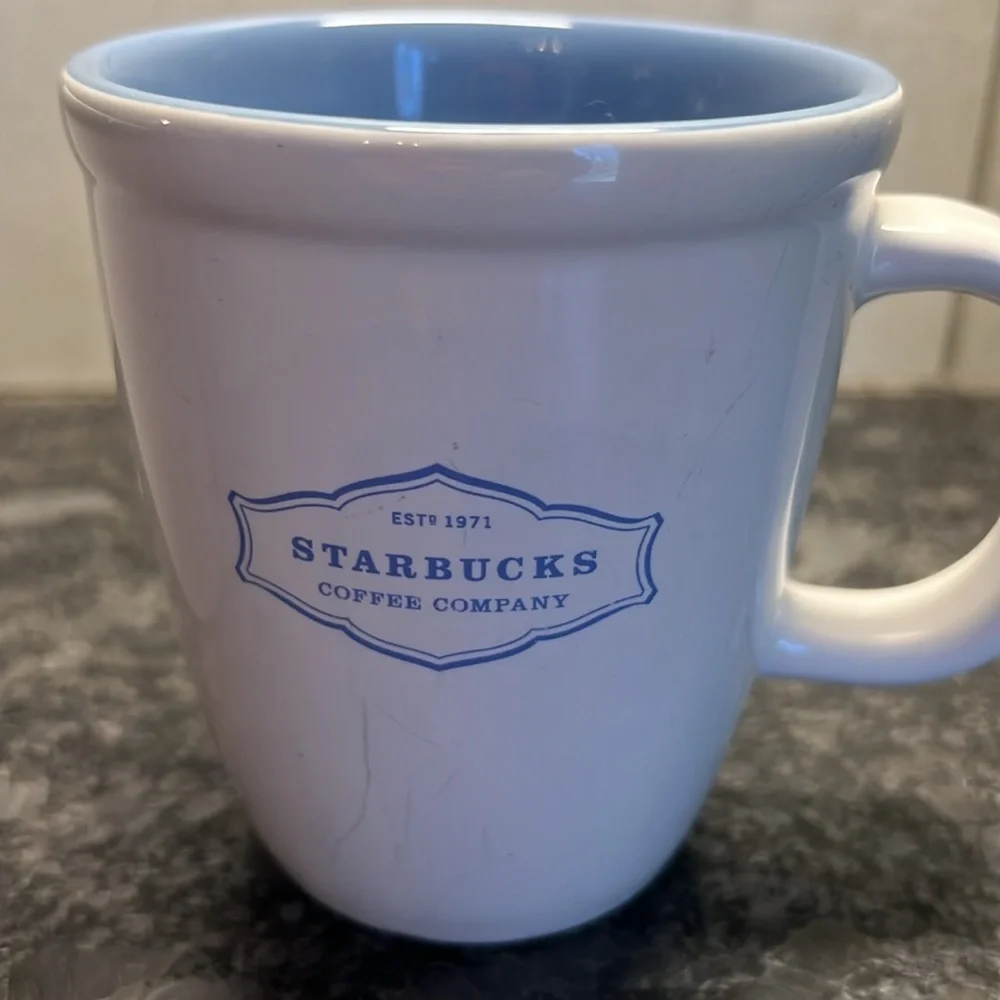 2-13oz Starbucks 2006 white and blue coffee mugs. In excellent condition.